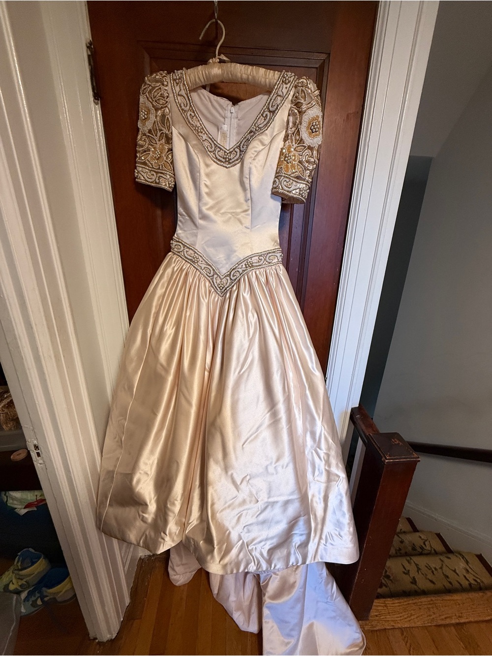 Light pink intricately  beaded Mon Cheri Gown Sold at Fontina bridal shop